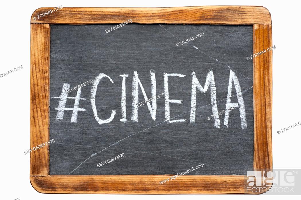 Stock Photo: cinema hashtag handwritten on vintage school slate board isolated on white.