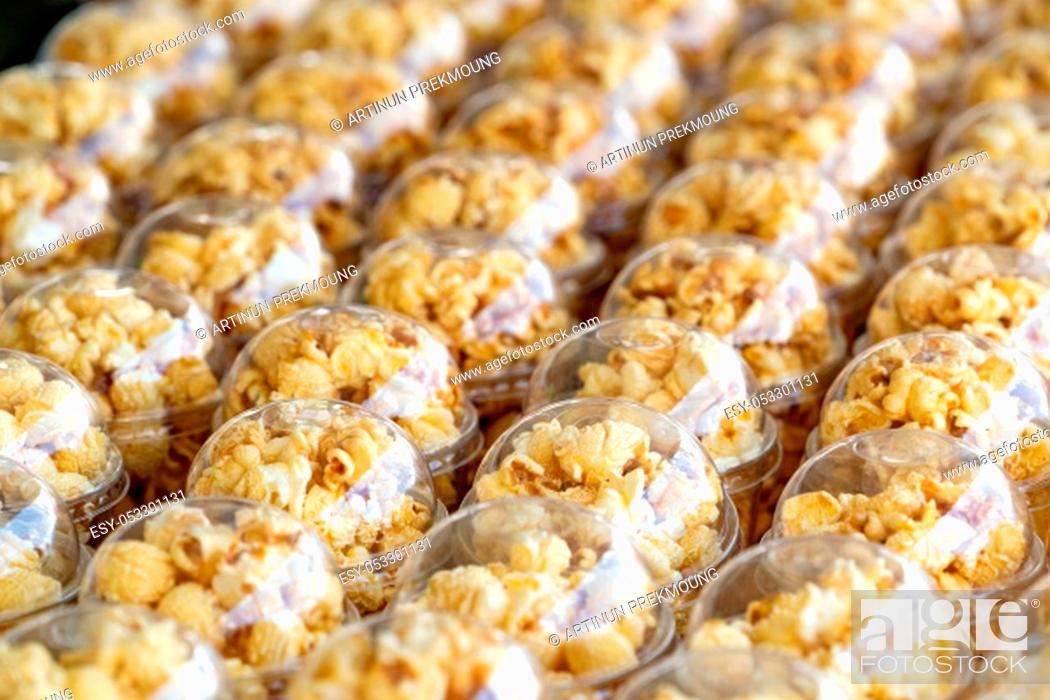 Stock Photo: Popcorn in a plastic cup is beautifully placed. Unhealthy food or snack concept. Tasty salty popcorn. Carbohydrates food. Junk food.