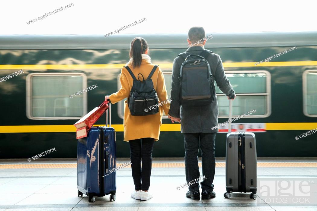 Stock Photo: Young lovers at the railway station.
