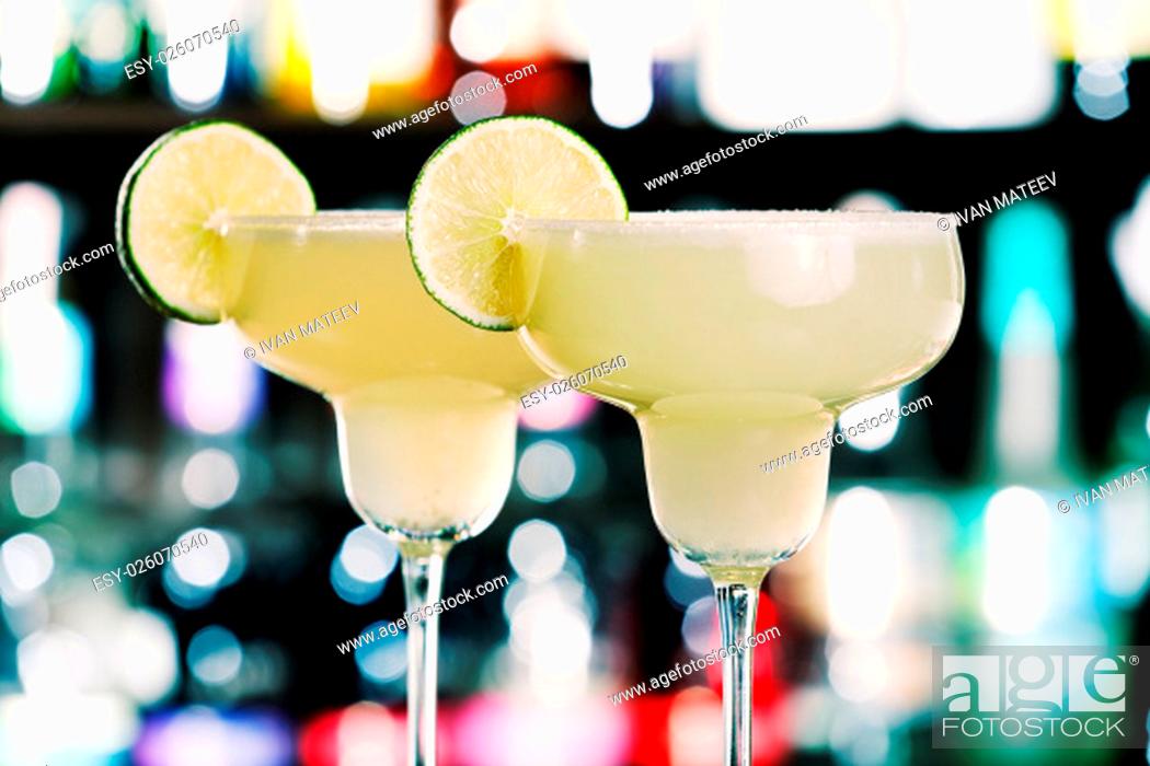 Stock Photo: The margarita is a cocktail consisting of tequila mixed with orange-flavoured liqueur and lime or lemon juice, often served with salt on the glass rim.