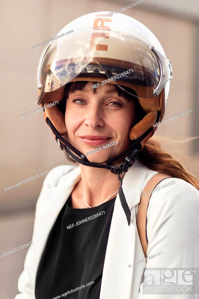 Stock Photo: Woman wearing helmet.