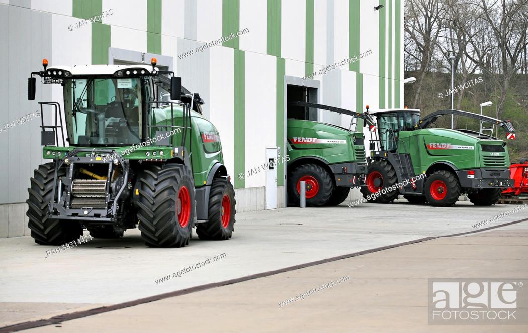Stock Photo: An employee drives a Fendt Katana 65 corn chopper to do the quality check on the compound of former barracks of the German armed forces in Hohenmoelsen, Germany.
