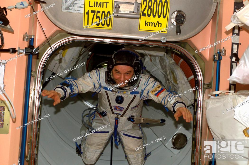 Stock Photo: Cosmonaut Valery G. Korzun, Expedition Five mission commander, wearing a Russian Sokol suit, floats through a hatch into the Unity node on the International.