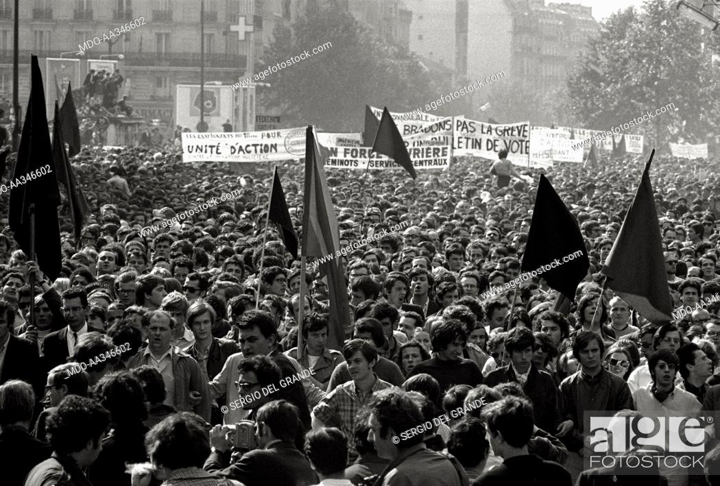 Stock Photo: The risk of a revolution in Paris has been averted. Red and black flags in a demonstration of workers, who are against the interruption of the general strike.