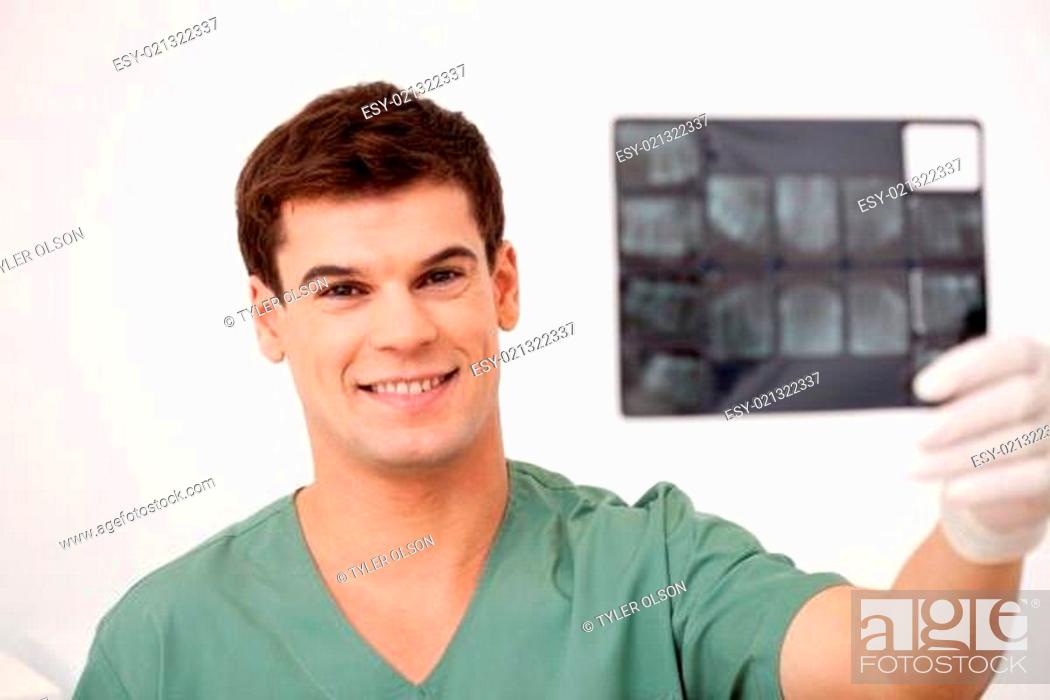Stock Photo: Dentist Looking at X-rays.