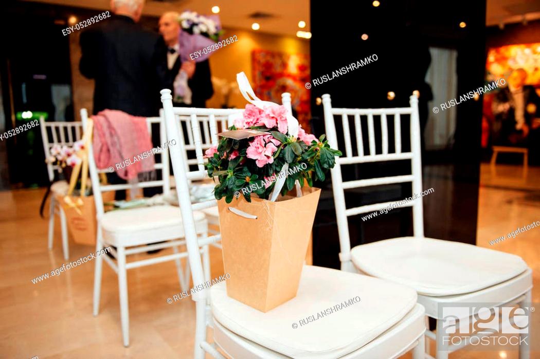 Stock Photo: Beautiful bouquet of bright flowers in basket for wedding ceremony.