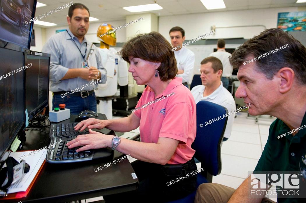 Stock Photo: European Space Agency (ESA) astronaut Paolo Nespoli (right foreground) and NASA astronaut Catherine Coleman, both Expedition 2627 flight engineers; along with.