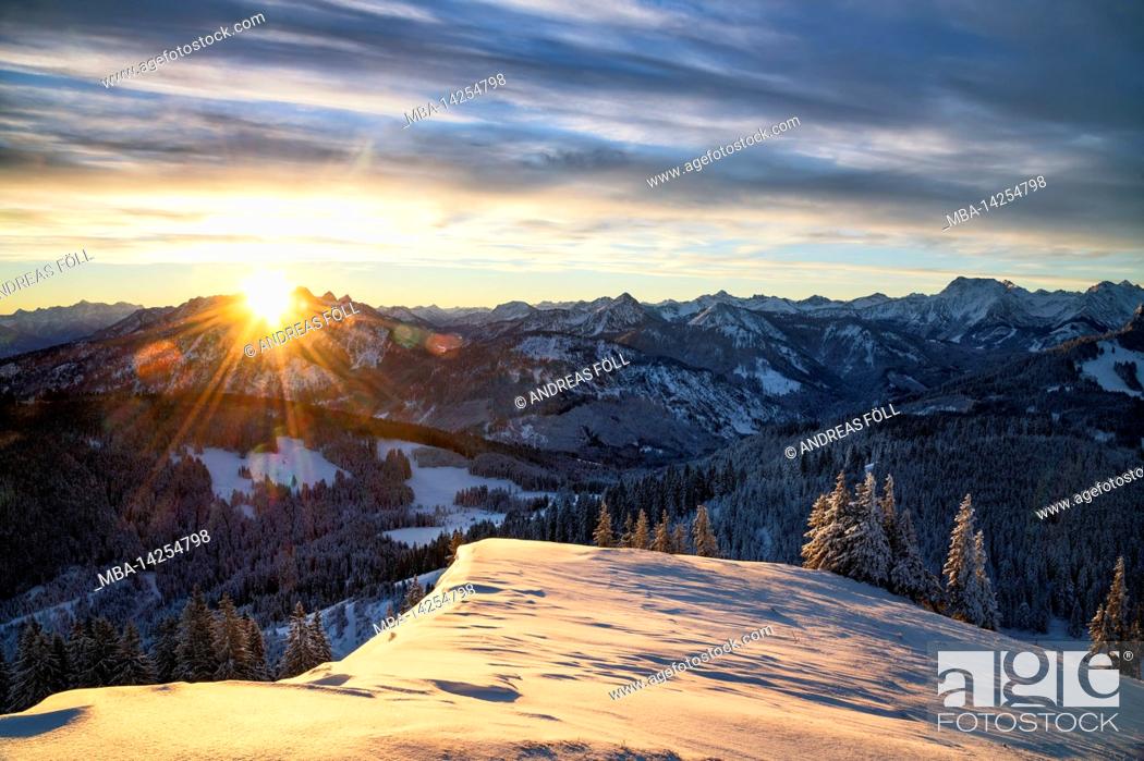 Stock Photo: Beautiful sunrise on a cold winter day in the mountains. View from the Reuterwanne to the Tannheimer mountains. Bavaria, Germany, border area Tyrol, Austria.