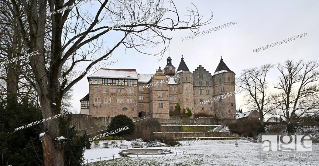 Stock Photo: 23 January 2023, Thuringia, Schleusingen: Snow lies in the castle garden of Schloss Bertholdsburg. Extensive restoration work is currently being prepared by.