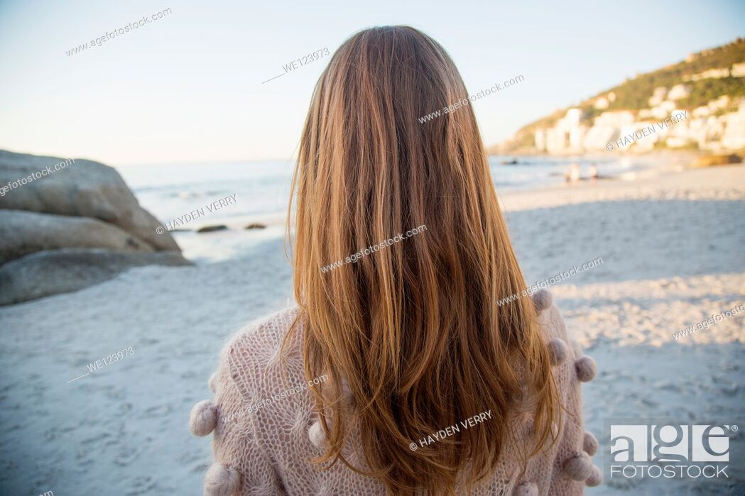Stock Photo: Young Woman Sat On Beach.