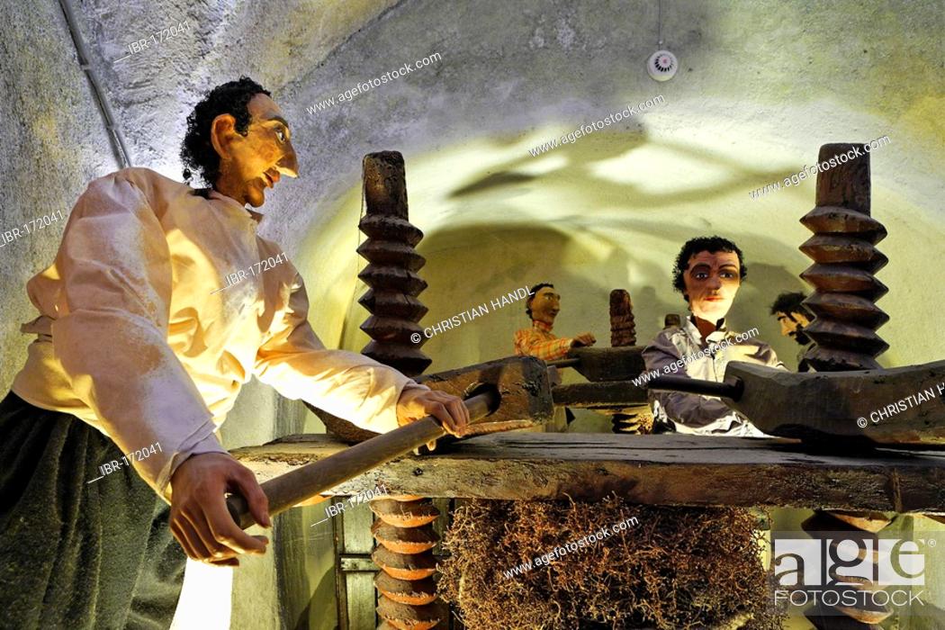 Stock Photo: An old hand operated wooden vine press brought to the island 1660 by catholic monks, wine museum and vinery Koutsouyanopoulos, Santorini, Greece.