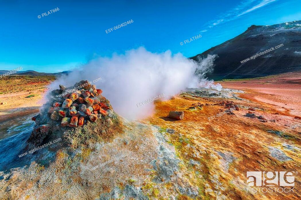 Stock Photo: Steaming cone in Hverir geothermal area with boiling mudpools and steaming fumaroles in Iceland Location: geothermal area Hverir, Myvatn region.