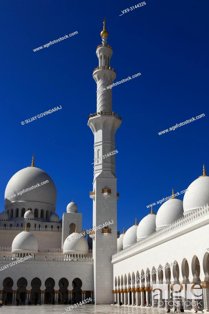 Stock Photo: Abu Dhabi, UAE: December 29, 2010: The interior courtyard of the all marble Sheikh Zayed Grand Mosque in the Capital city of the United Arab Emirates.