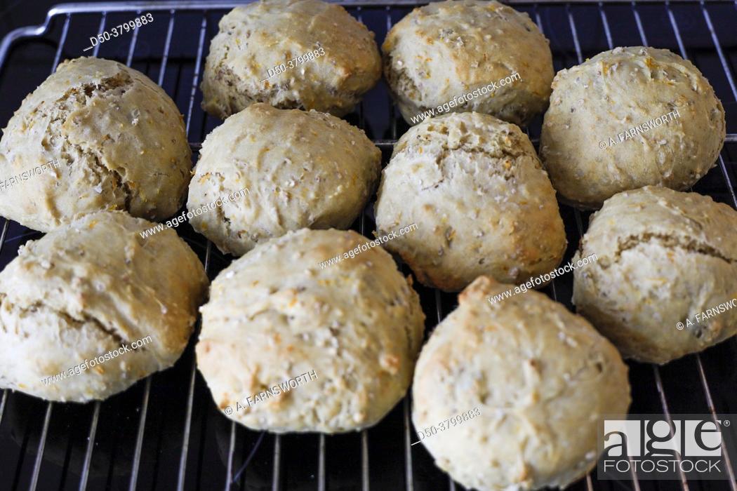 Stock Photo: Homemade bread rolls on an oven rack.