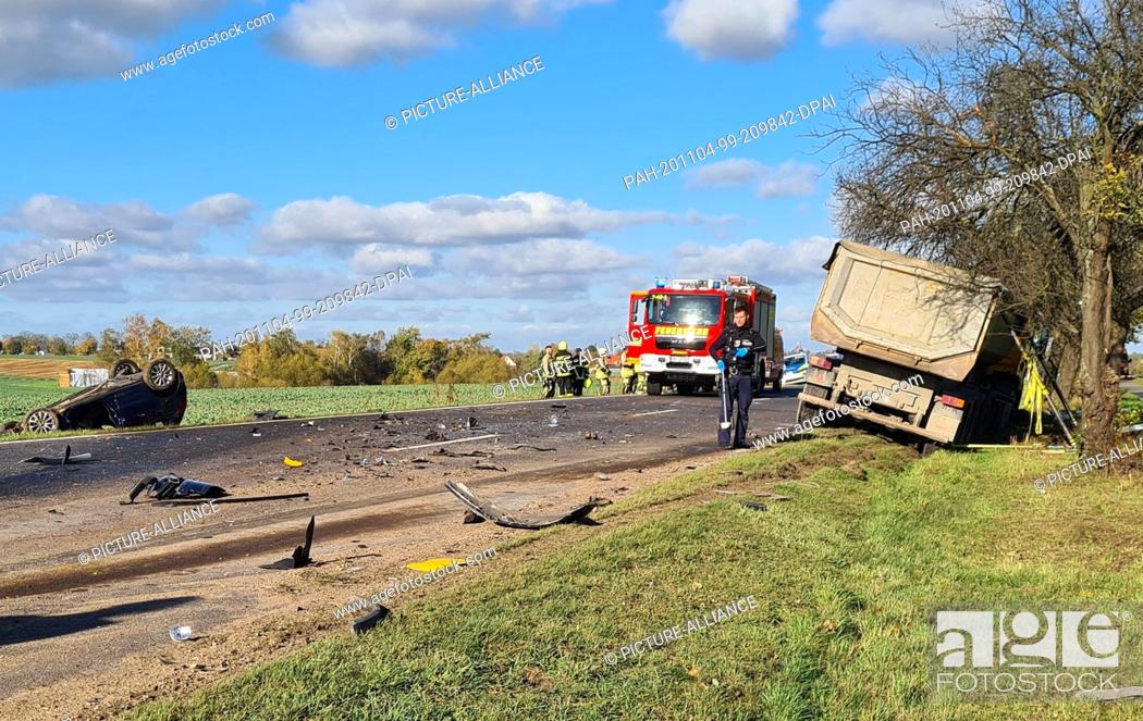 Stock Photo: 04 November 2020, Brandenburg, Dallgow: Police and firefighters are on the scene of the accident on the L20 near Dallgow.