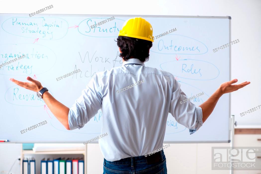 Photo de stock: Young male architect in front of the whiteboard.