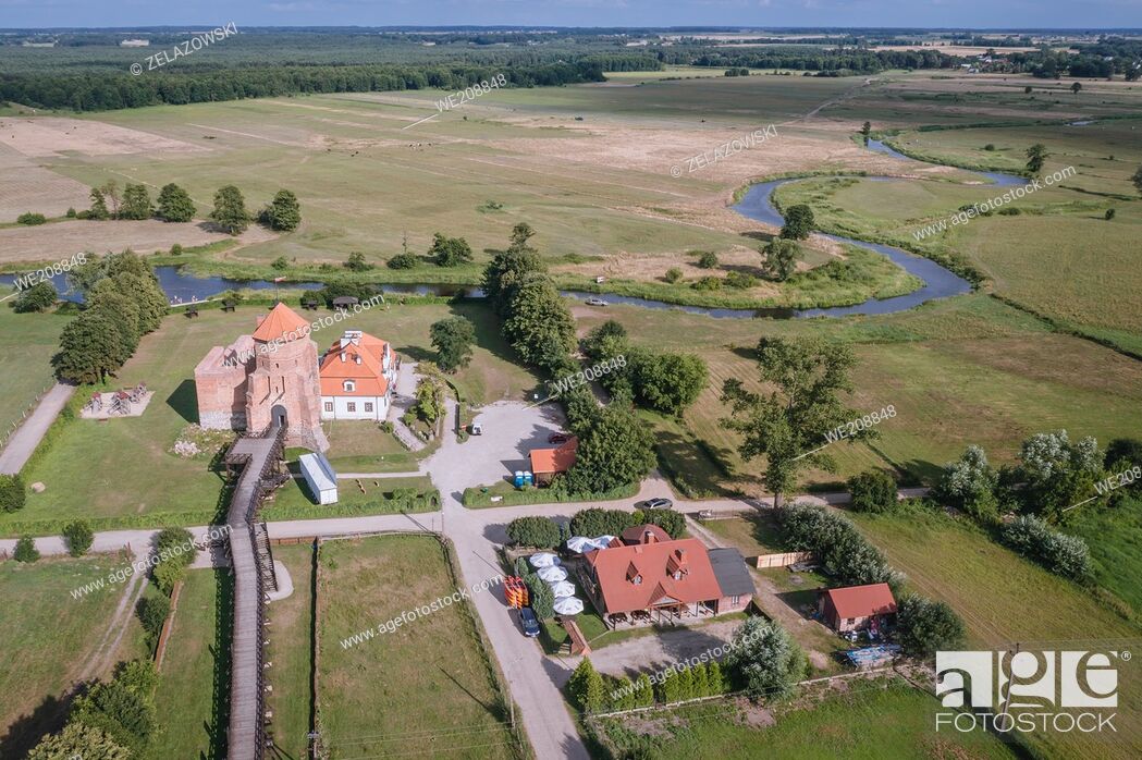 Stock Photo: Drone view of Gothic ducal castle from 15th century on the bank of Liwiec River in Liw village, Masovian Voivodeship of Poland.