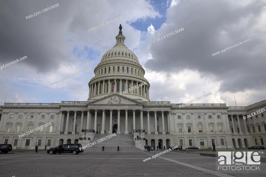 Stock Photo: A hearse carrying the casket of late Senator John McCain, Republican of Arizona, arrives at the United States Capitol in Washington, DC on August 31.