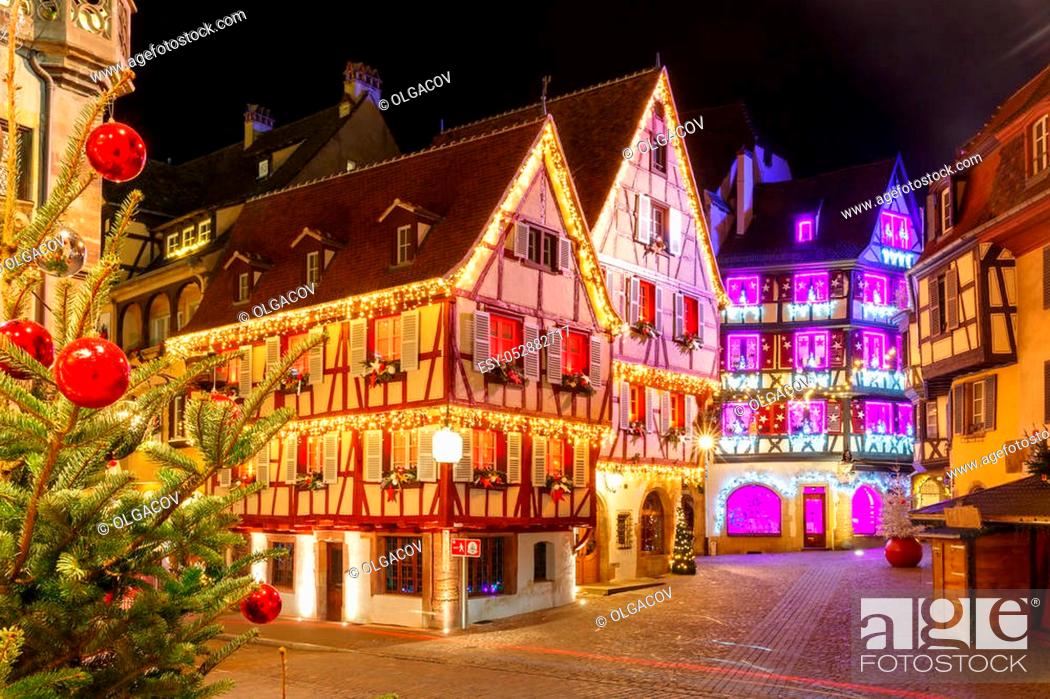 Stock Photo: Traditional Alsatian half-timbered houses in old town of Colmar, decorated and illuminated at christmas time, Alsace, France.