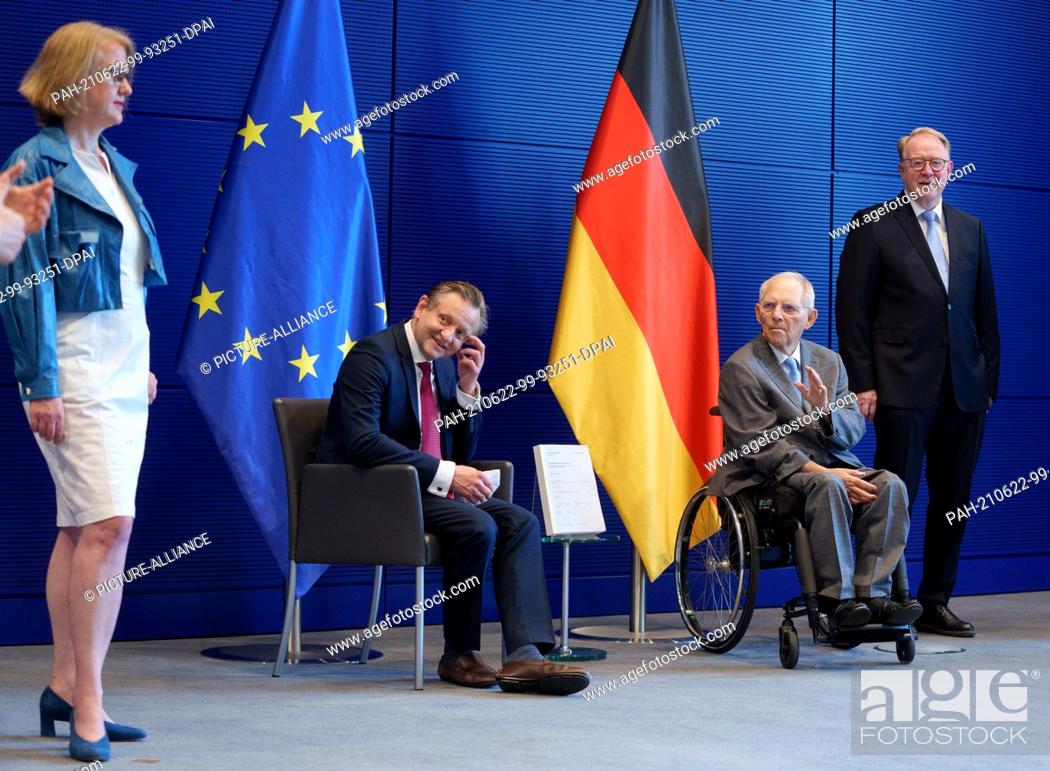 Stock Photo: 22 June 2021, Berlin: Wolfgang Schäuble (2nd from right, CDU), President of the Bundestag, accepts the final report of the Wirecard Investigation Committee from.