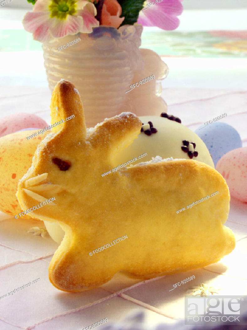 Stock Photo: Easter Bunny in bread dough, Easter eggs & flower vase.