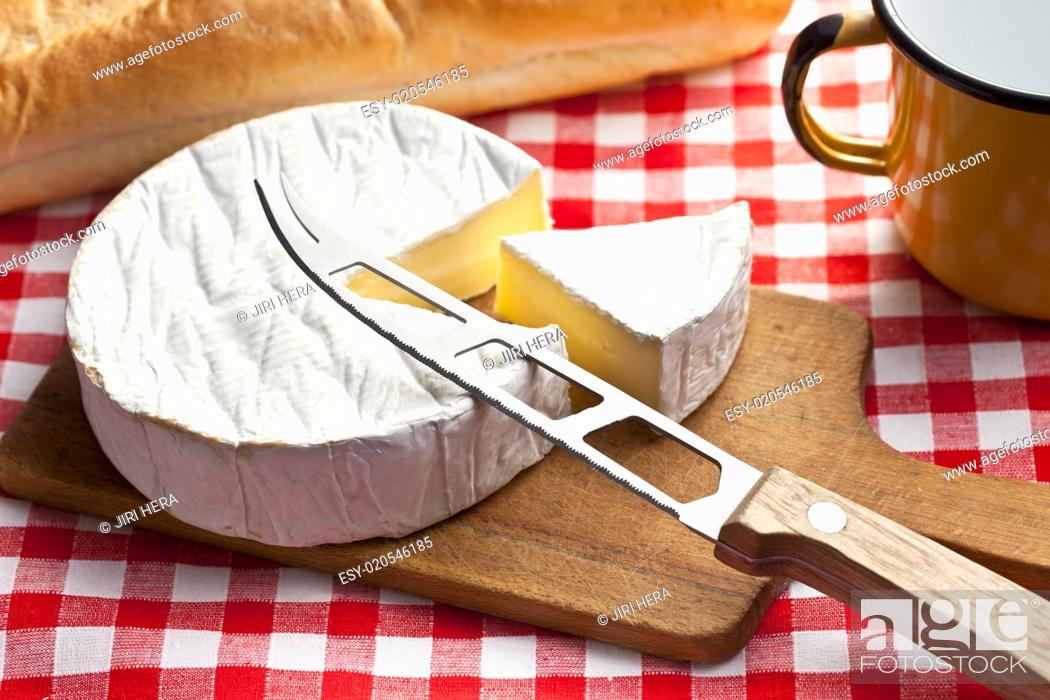 Stock Photo: camembert cheese on kitchen table.