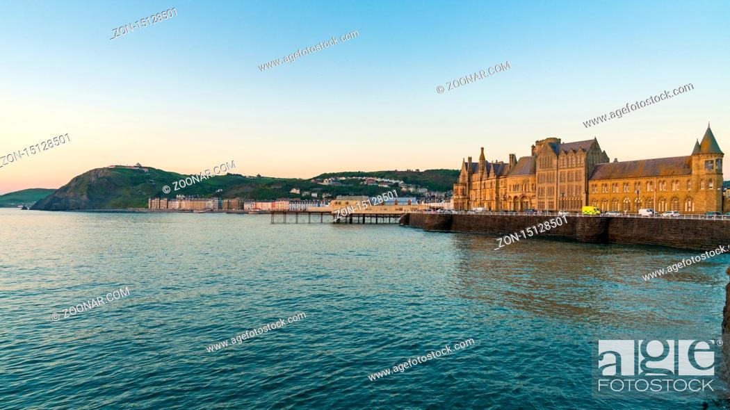 Stock Photo: Aberystwyth, Ceredigion, Wales, UK - May 25, 2017: Evening view over the Marine Terrace with Yr Hen Goleg (Aberystwyth University Old College) on the right.