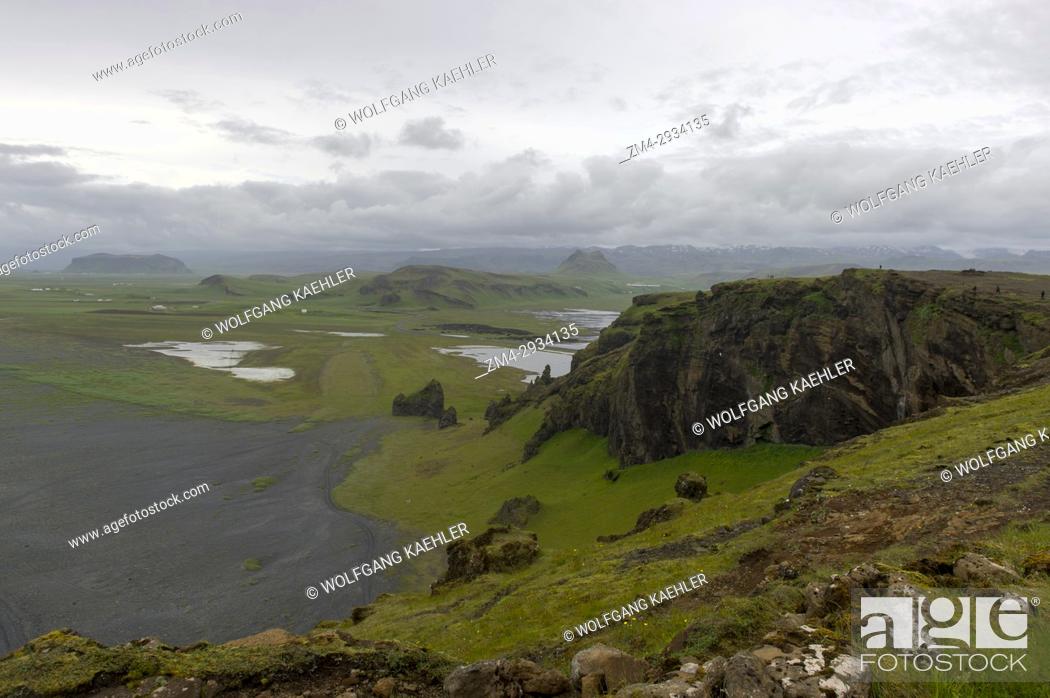Stock Photo: View westwards from top of Dyrholaey, a small peninsula, or promontory, is located on the south coast of Iceland, not far from the village Vík.