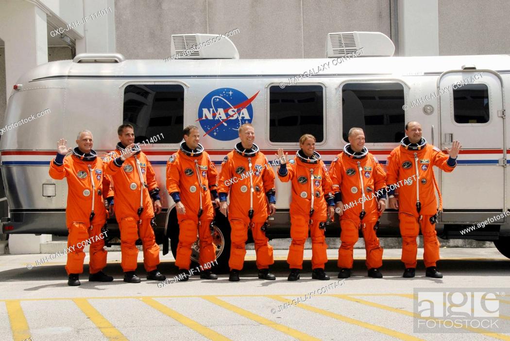 Stock Photo: After suiting up, the STS-127 crew members pause alongside the Astrovan to wave farewell to onlookers before heading for launch pad 39A for the launch of Space.