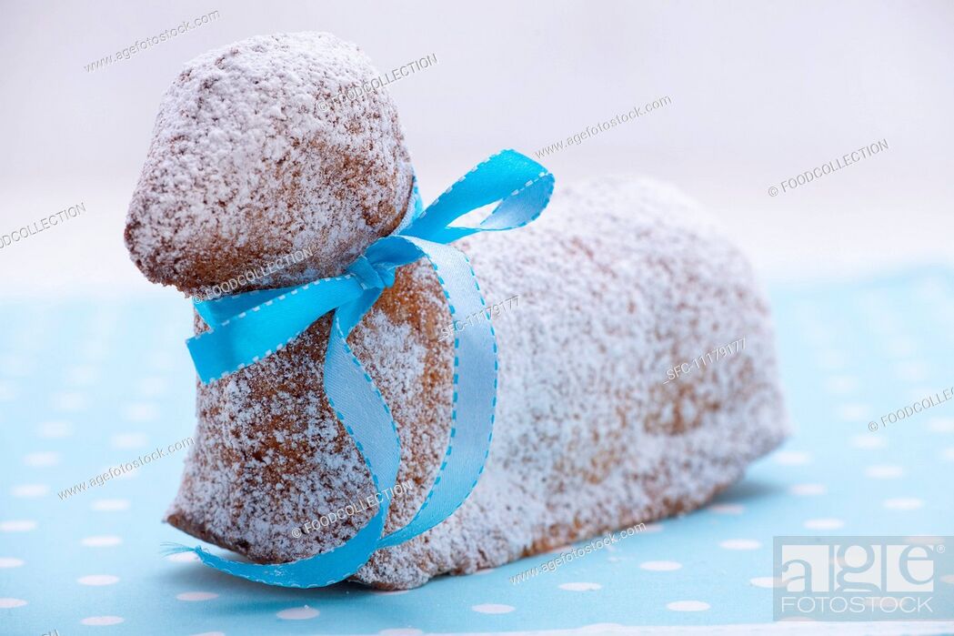 Stock Photo: A sweet Easter lamb cake with a blue ribbon.