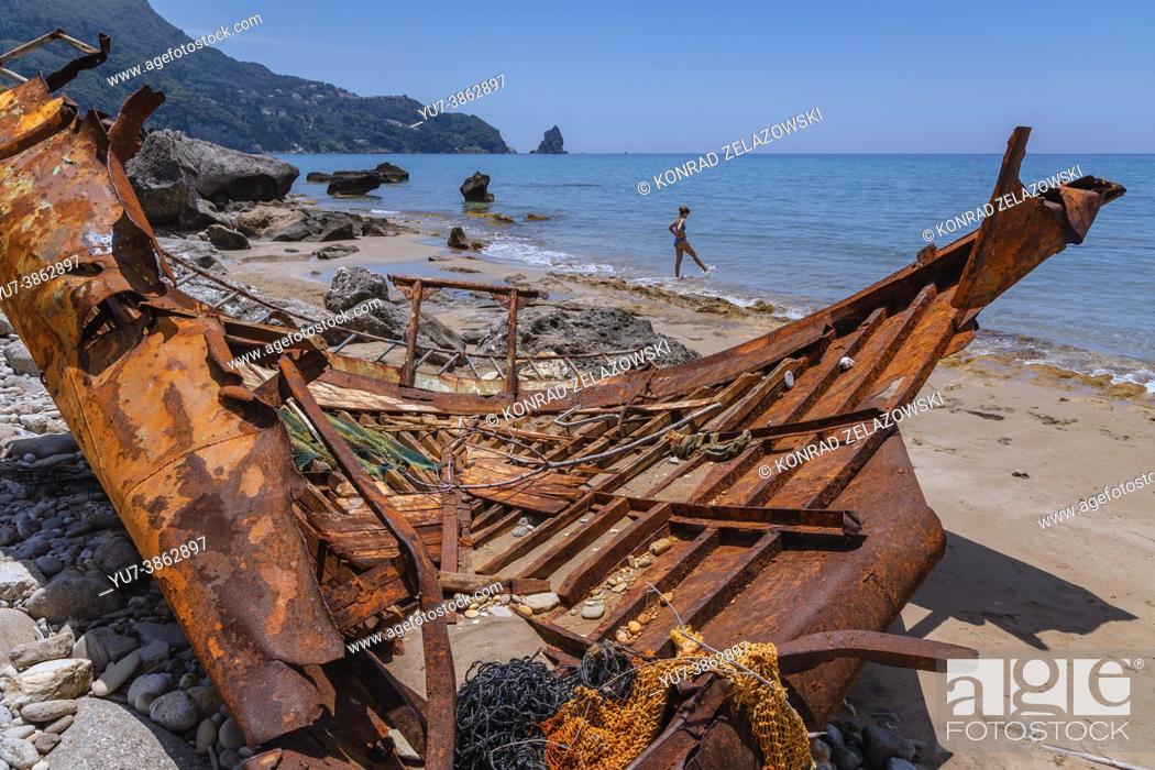 Stock Photo: Rusty remains of shipwreck on a shore in Agios Gordios town on a Greek Island of Corfu.