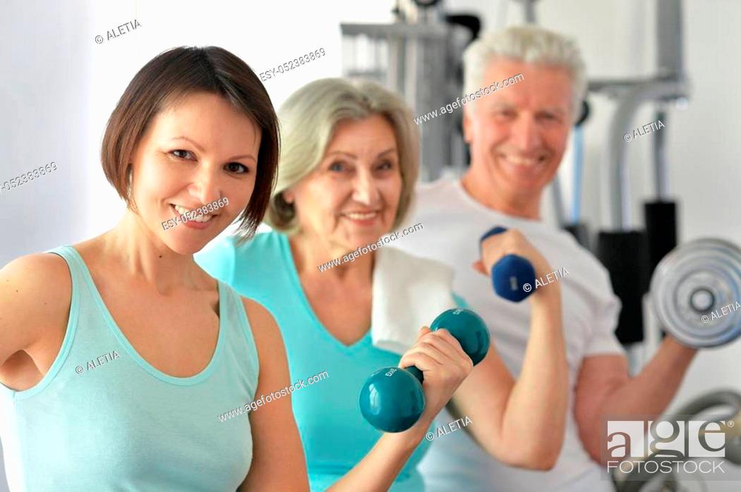 Stock Photo: Portrait of a family doing exercises, sport concept.