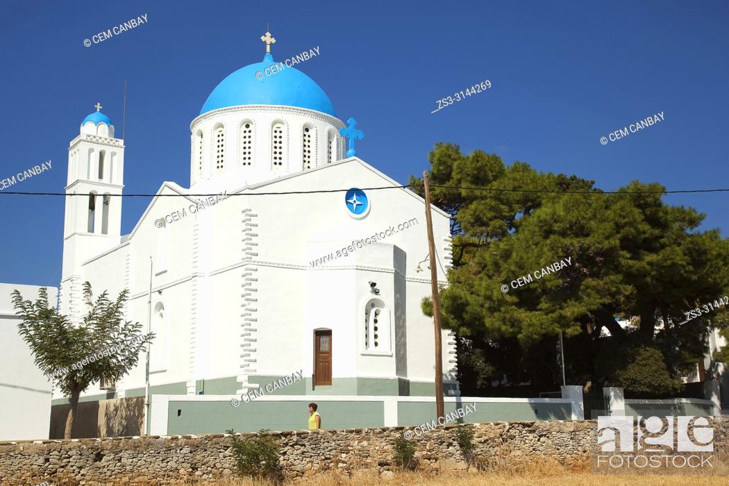 Stock Photo: Woman in front of the Panagia Zoodohos Pigi Church in Kato Petali village, Sifnos Island, Cyclades Islands, Greek Islands, Greece, Europe.
