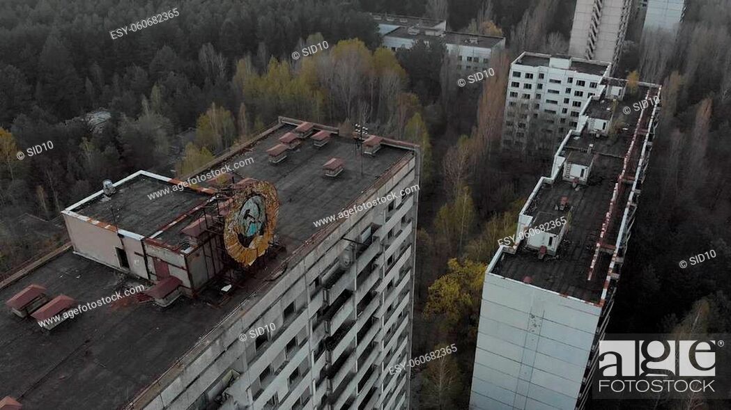 Stock Photo: Soviet coat of arms on a high-rise building in Pripyat. City of Pripyt near the Chernobyl nuclear power plant.