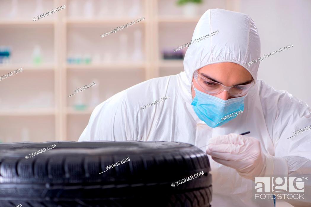 Stock Photo: Expert is looking at car accident evidence.