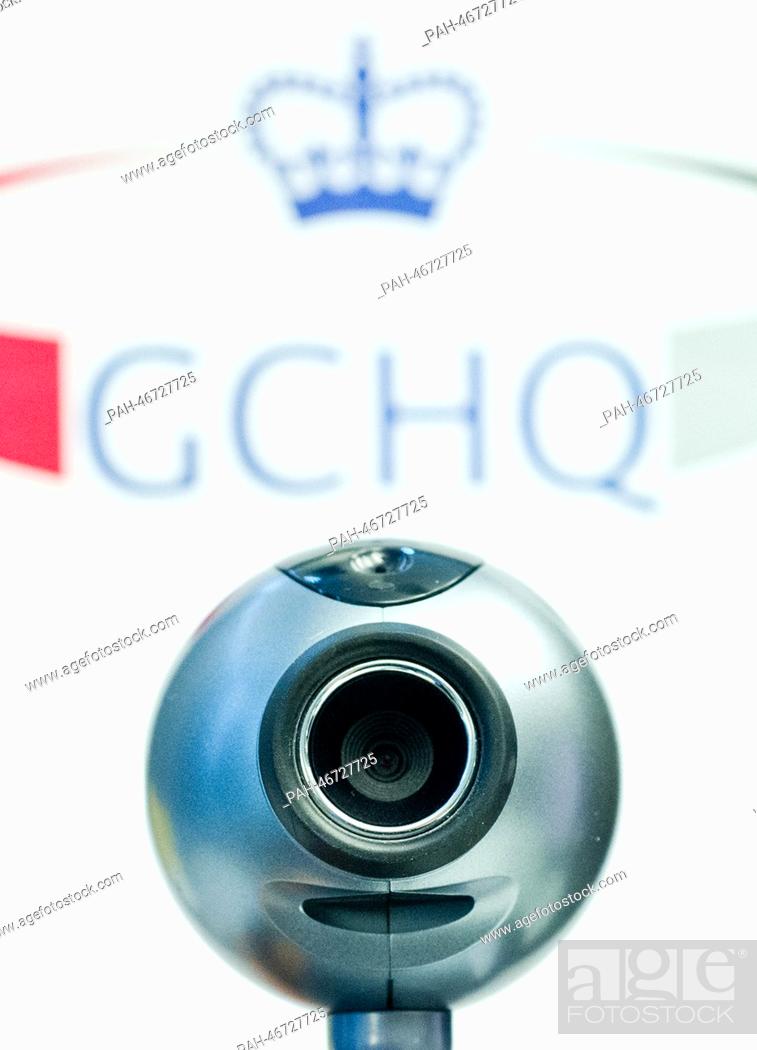 Stock Photo: ILLUSTRATION - An illustration shows a webcam in front of the logo of the British intelligence agency Government Communications Headquarters (GCHQ) in Berlin.