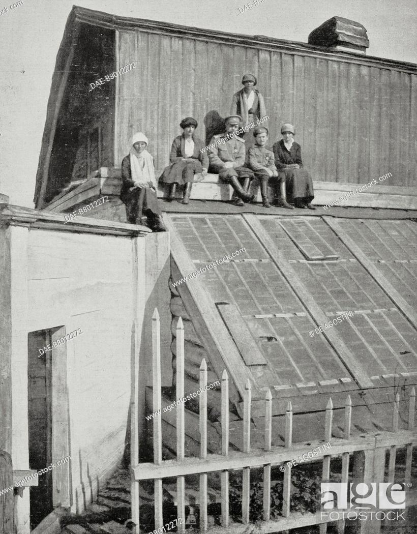 Stock Photo: The Romanov family warming up in the sun on the roof of a greenhouse during captivity in Tobolsk (September 1917-October 1918), from left to right Olga.