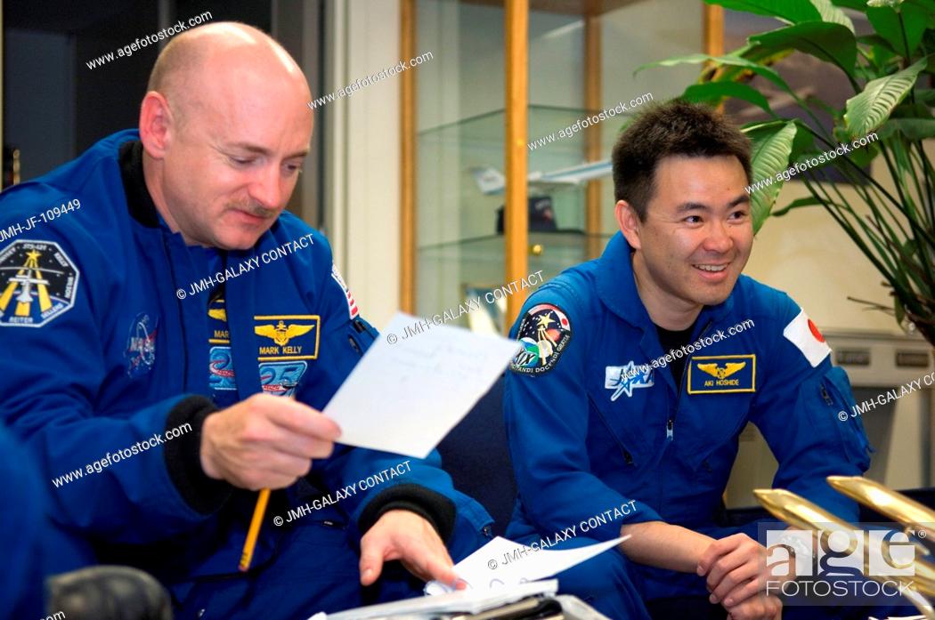 Stock Photo: Astronauts Mark E. Kelly (left), STS-124 commander; and Akihiko Hoshide, mission specialist representing the Japan Aerospace Exploration Agency (JAXA).
