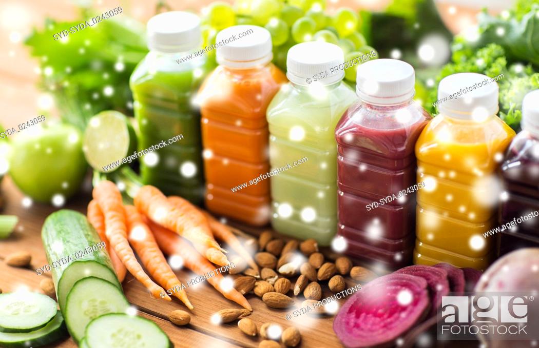 Stock Photo: bottles with different fruit or vegetable juices.