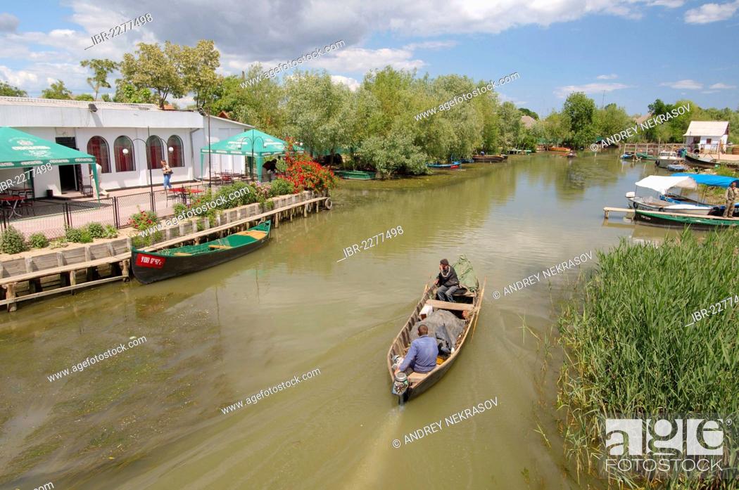 Stock Photo: Boat on canal in Vilkovo or Vylkove, also known as Ukrainian Venice, Ukraine, Eastern Europe.