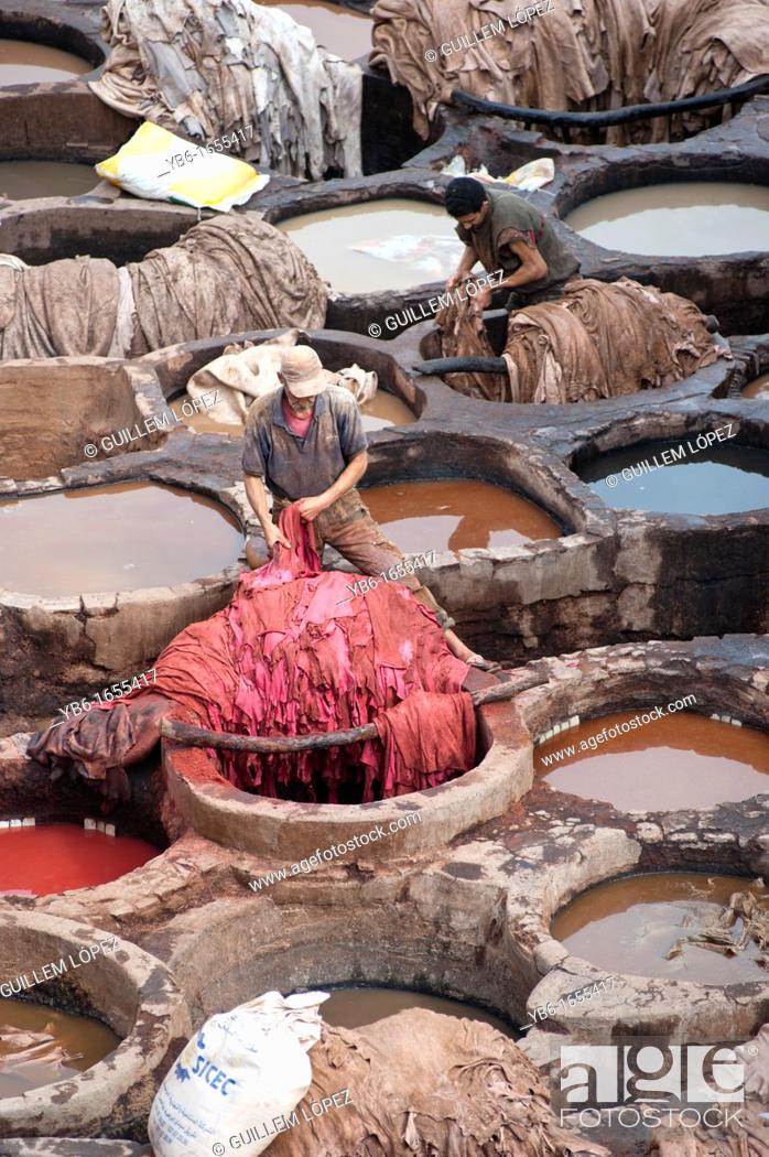 Stock Photo: People at work in the Chouwara Leather Tannery of Fez, Morocco.