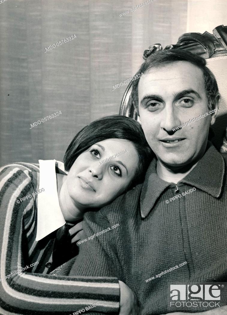 Stock Photo: Italian TV host Pippo Baudo beside his partner and Italian actress Adriana Russo at home. 1980s.