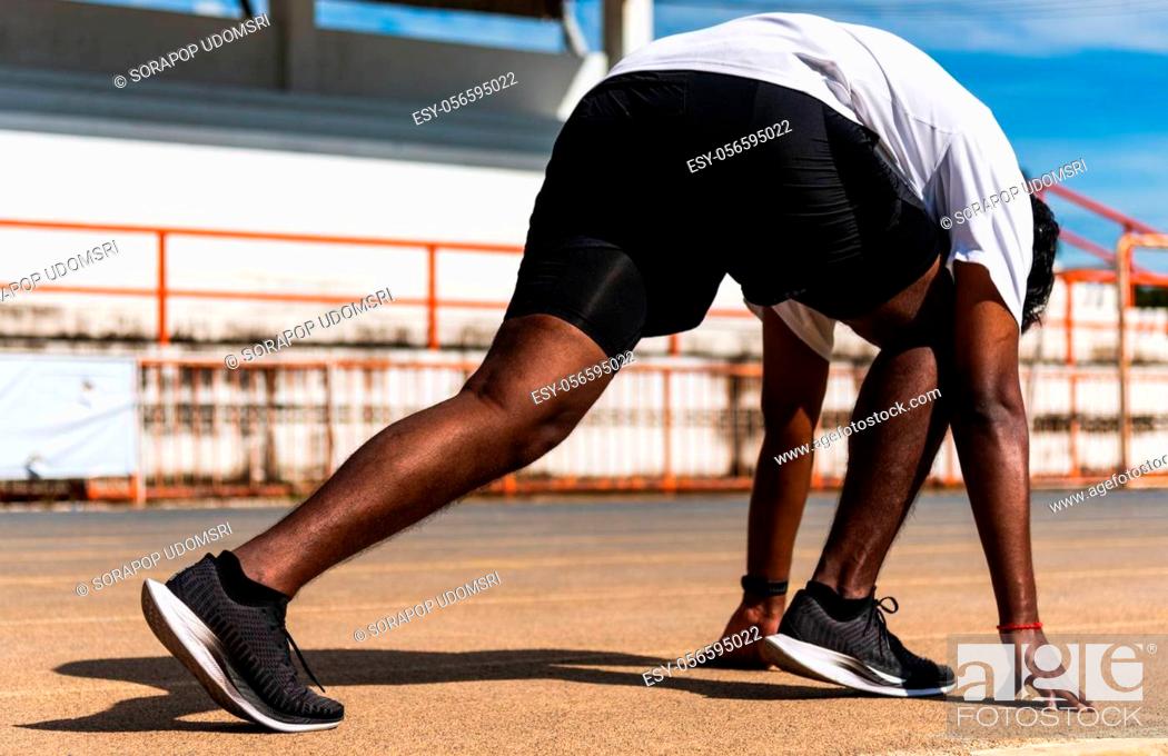 Photo de stock: Asian young athlete sport runner black man active ready to start running training at the outdoor on the treadmill for a step forward, healthy exercise workout.