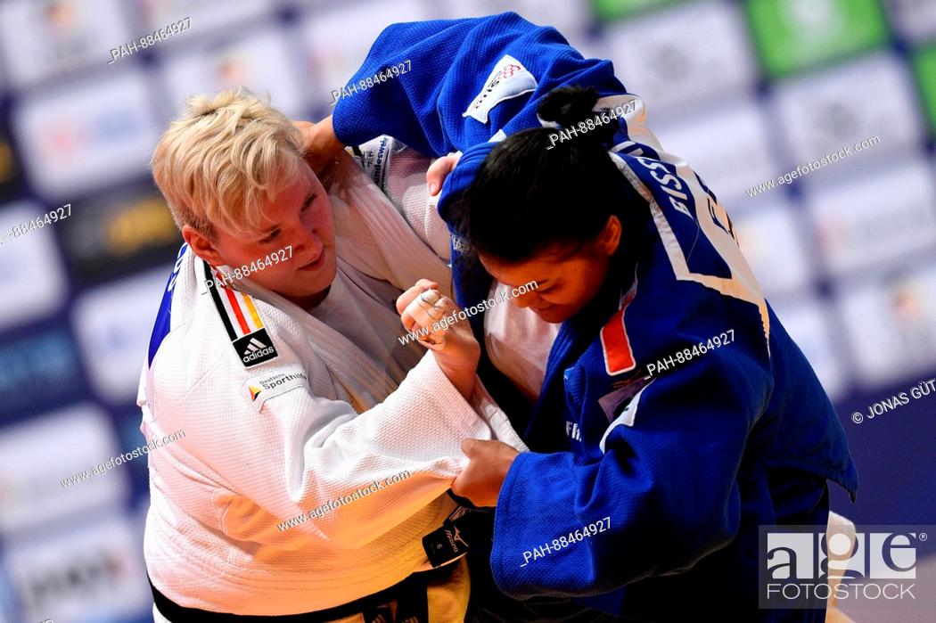 Stock Photo: Jasmin Kuelbs (white, Germany) and Eva Bisseni (blue, France) in action during the women's up to 78 kg body weight competition at the Judo Grand Prix in the.