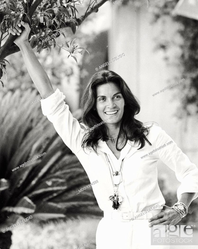 Stock Photo: Portrait of Florinda Bolkan smiling. Portrait of Brazilian actress Florinda Bolkan smiling in a garden. Taormina, 1970s.
