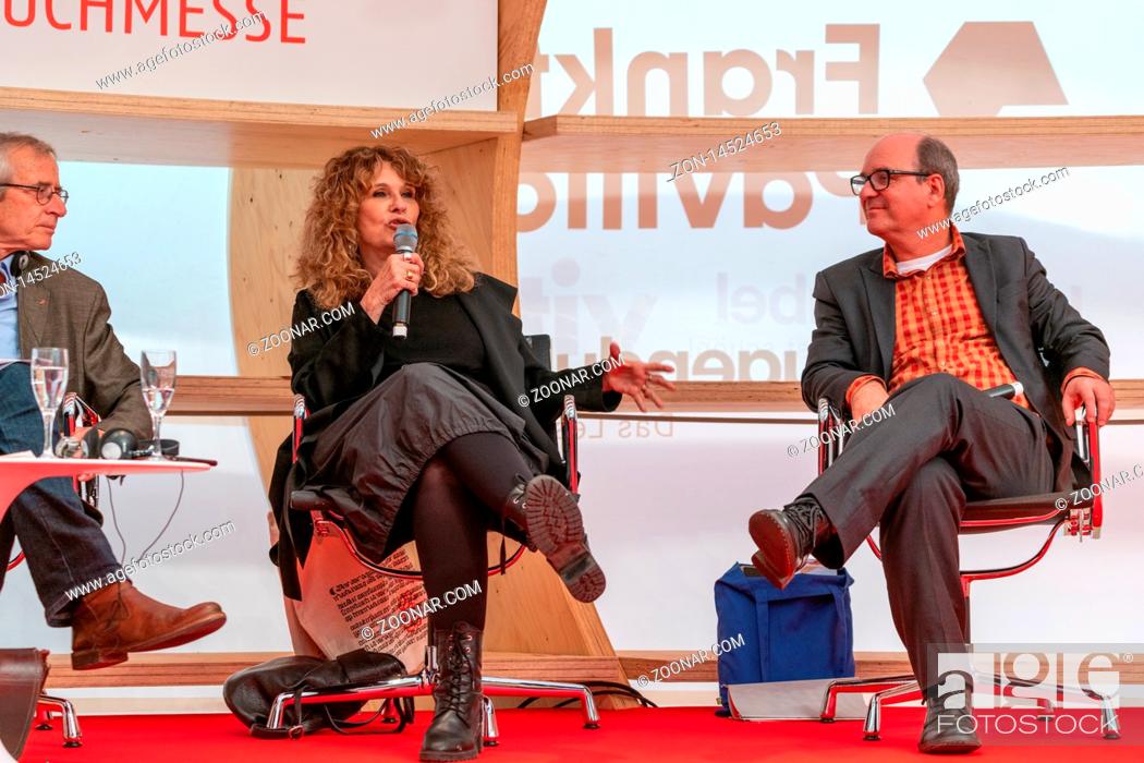 Stock Photo: FRANKFURT AM MAIN, Germany - October 17 2019: Luiz Ruffato and Gioconda Belli talking on stage at 71st Frankfurt Book Fair / Buchmesse Frankfurt.
