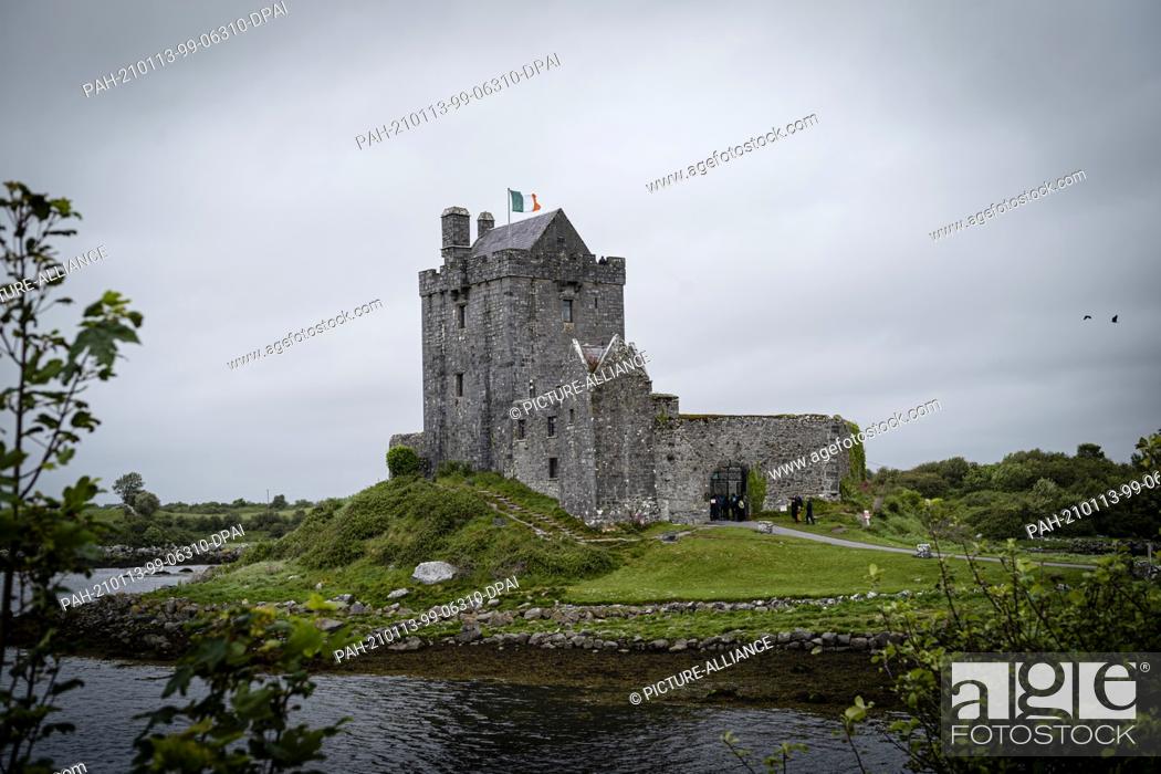 Stock Photo: 30 May 2019, Ireland, Clare Circuit: Dunguaire Castle near the Irish city of Galway. The small castle offers tourists along the Wild Atlantic Way a short stop.