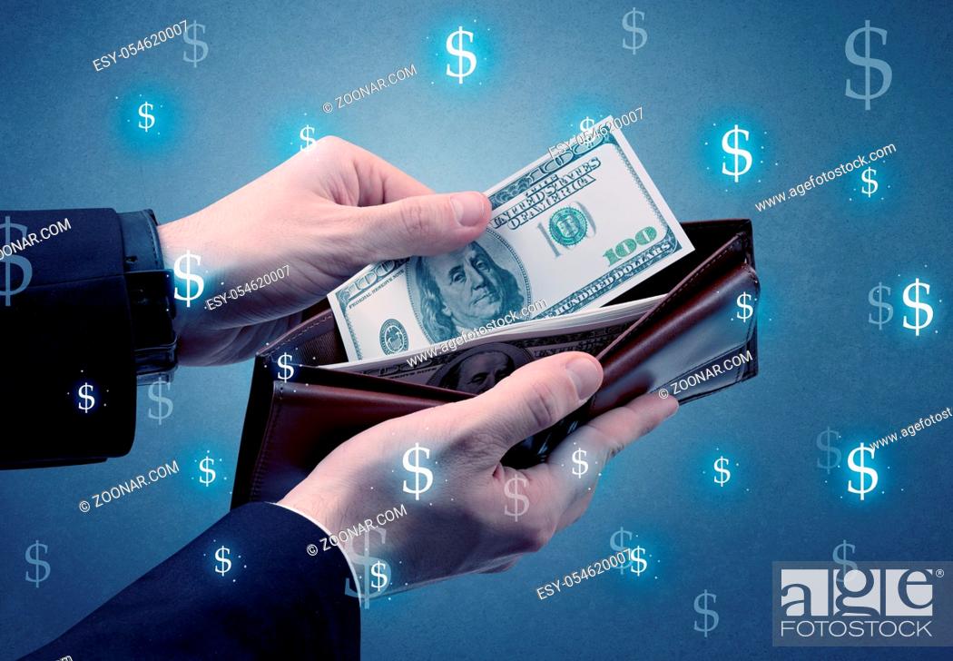 Hand takes out dollar money from a wallet with dollar symbol wallpaper,  Stock Photo, Picture And Low Budget Royalty Free Image. Pic. ESY-054620007  | agefotostock
