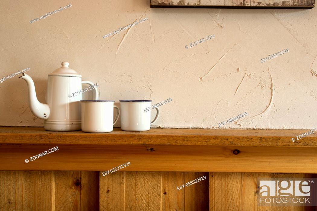 Stock Photo: Old vintage teapot and two cup of tea on wooden shelf, antique interior.