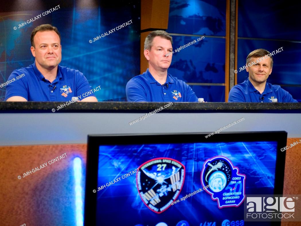 Stock Photo: Russian cosmonaut Andrey Borisenko (right), Expedition 27 flight engineer and Expedition 28 commander; Russian cosmonaut Alexander Samokutyaev (center) and NASA.